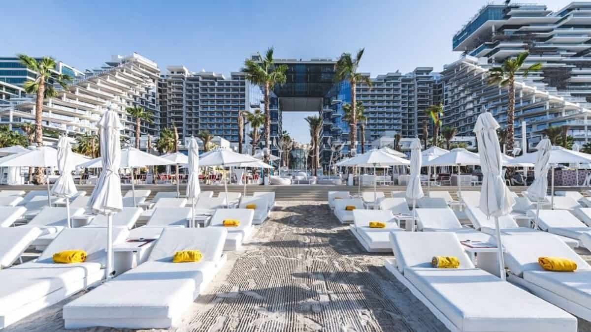 Sunbeds lined up along the private beach at FIVE Palm Jumeirah