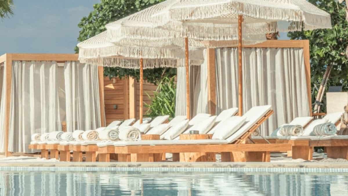 Kyma Beach infinity pool with sandy edges on Palm West Beach